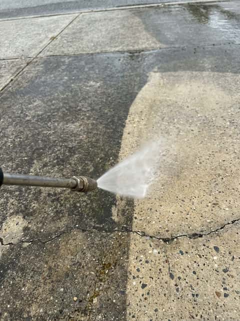 Perth residential driveway being pressure cleaned showing dirt removal