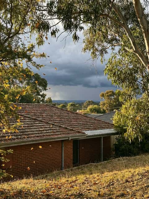Perth residential roof gutters being cleaned before storm season