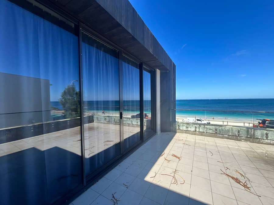 Beachfront balcony glass after cleaning, ocean view, Purified Group Perth