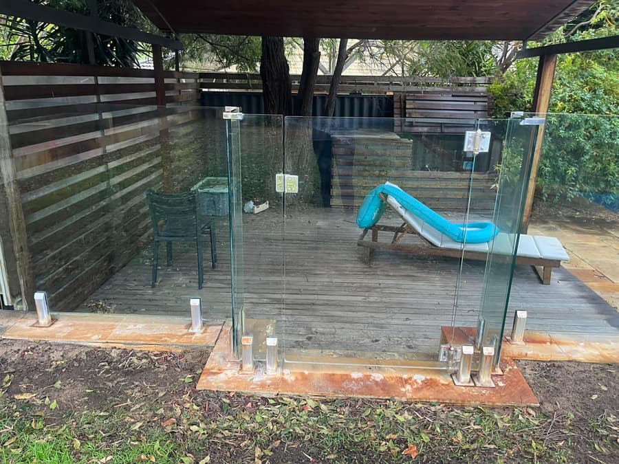 After: clean glass pool fence, pool and garden visible, Perth