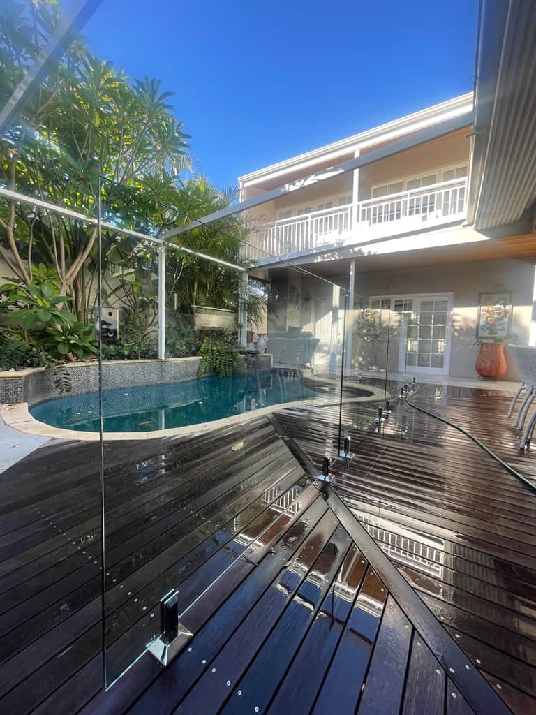 Pressure-cleaned pool deck and glass balustrade at a Perth home