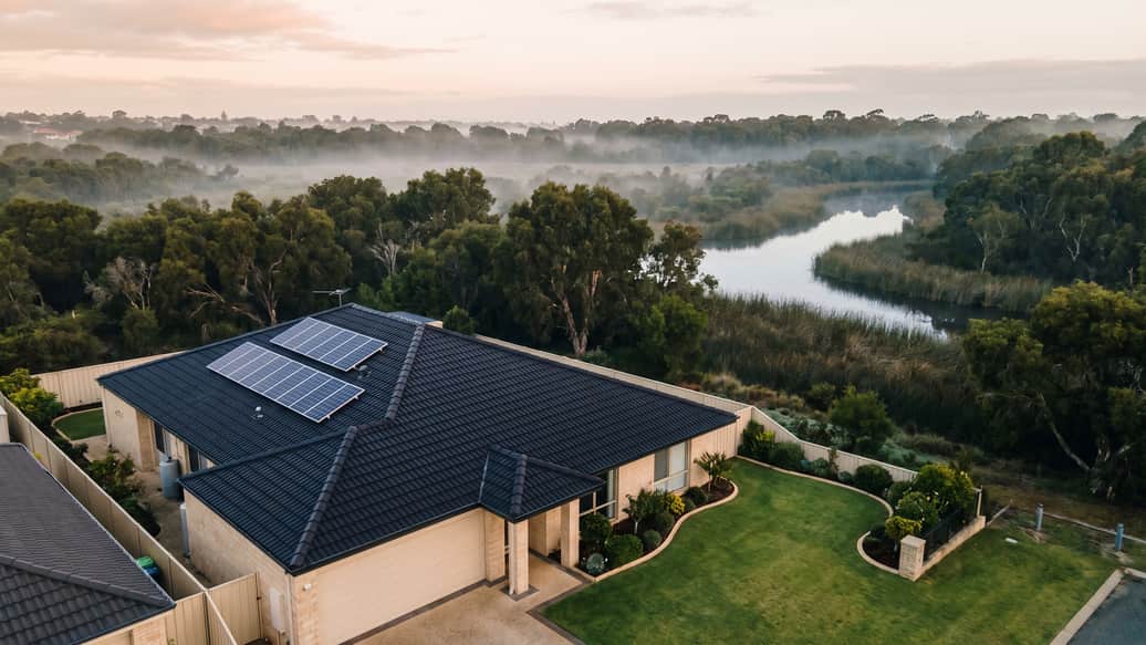 A Perth suburb near wetland reserve bushland, a home with solar panels visible, Beeliar