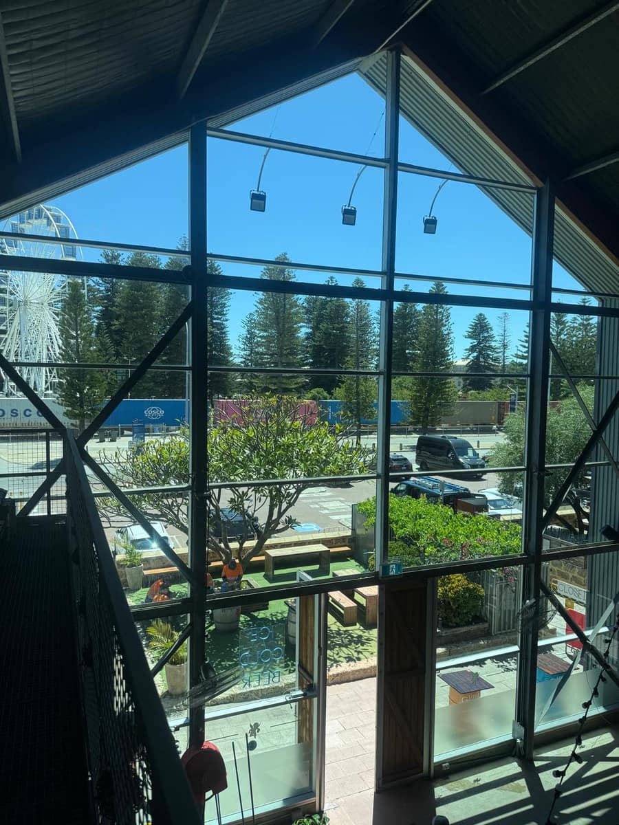 View through a freshly cleaned glass window toward Fremantle's waterfront